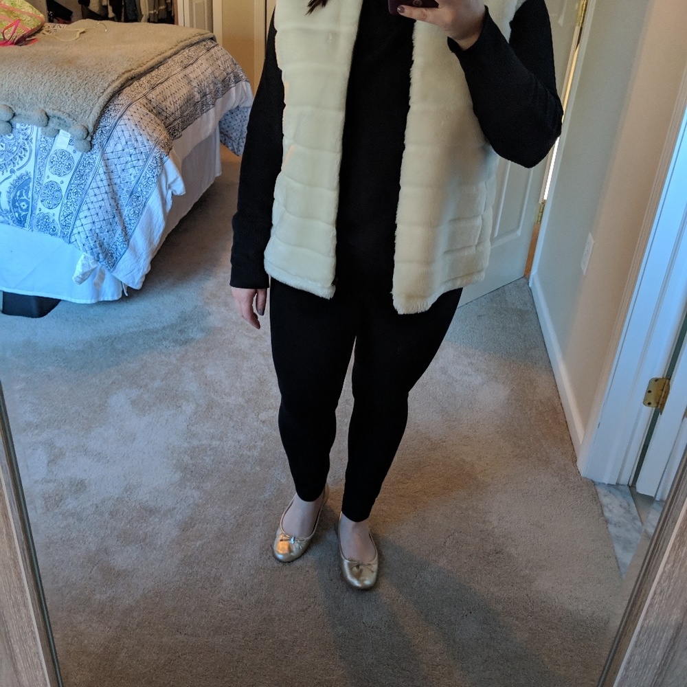White fur vest that is reversible